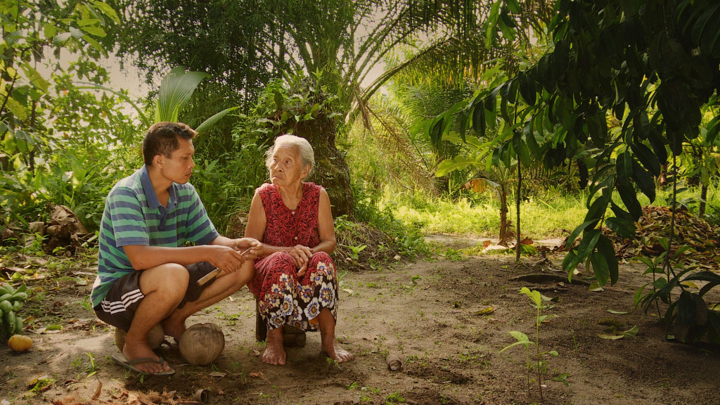 Adi and his mother, Rohani, share a solemn moment in Drafthouse Films' and Participant Media's "The Look of Silence." Courtesy of Drafthouse Films and Participant Media.
