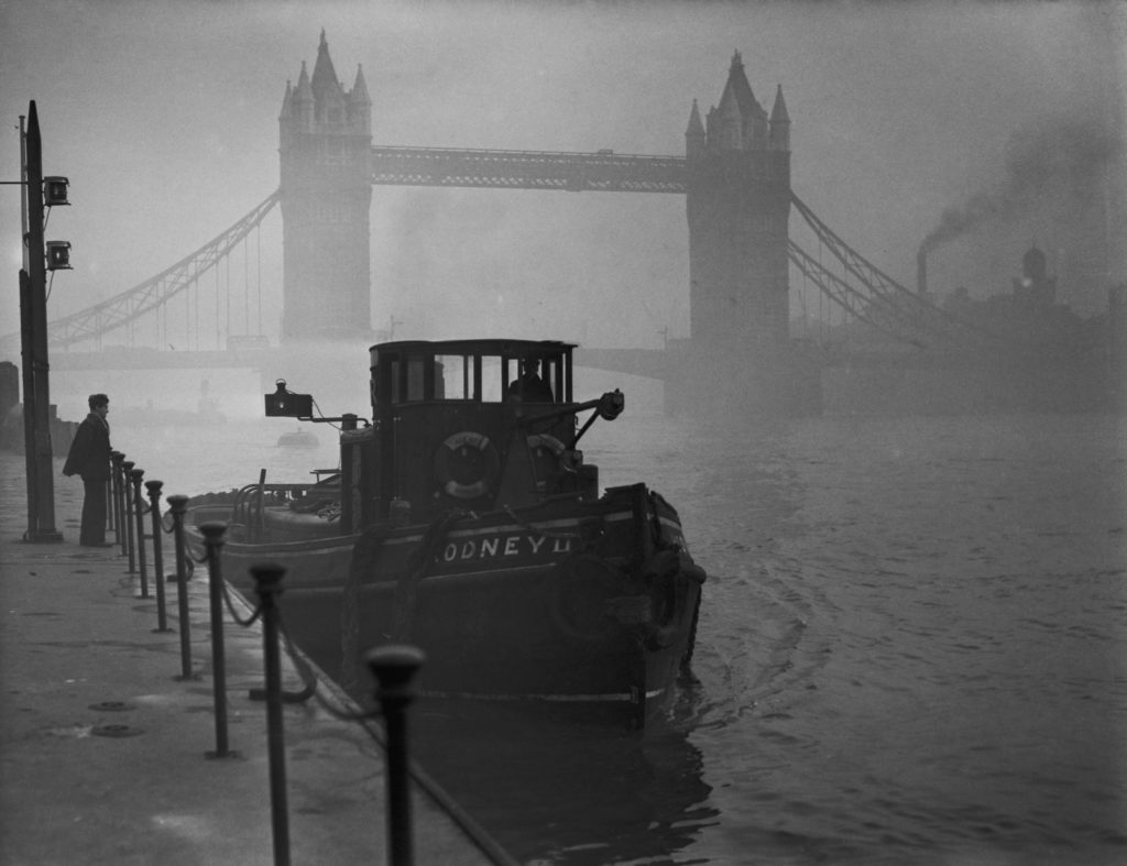 A tugboat on the Thames near Tower Bridge in heavy smog, 1952. (Photo by Fox Photos/Hulton Archive/Getty Images)