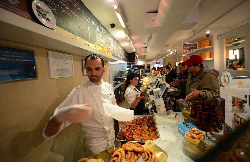 Customers line up for hours before Ansel's shop opens in the morning to have a chance to buy two cronuts per person out of the 200 cronuts Ansel produces daily. Credit EMMANUEL DUNAND/AFP/Getty Images