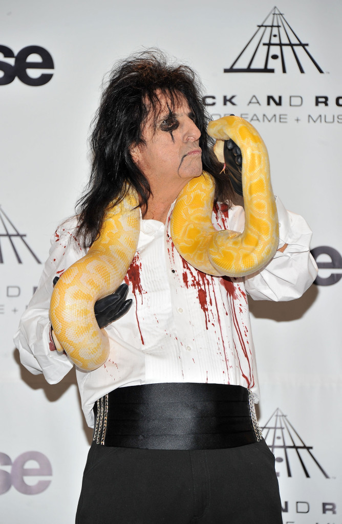 NEW YORK, NY - MARCH 14: Inductee Alice Cooper poses with a snake in the press room at the 26th annual Rock and Roll Hall of Fame Induction Ceremony at The Waldorf=Astoria on March 14, 2011 in New York City. (Photo by Stephen Lovekin/Getty Images)