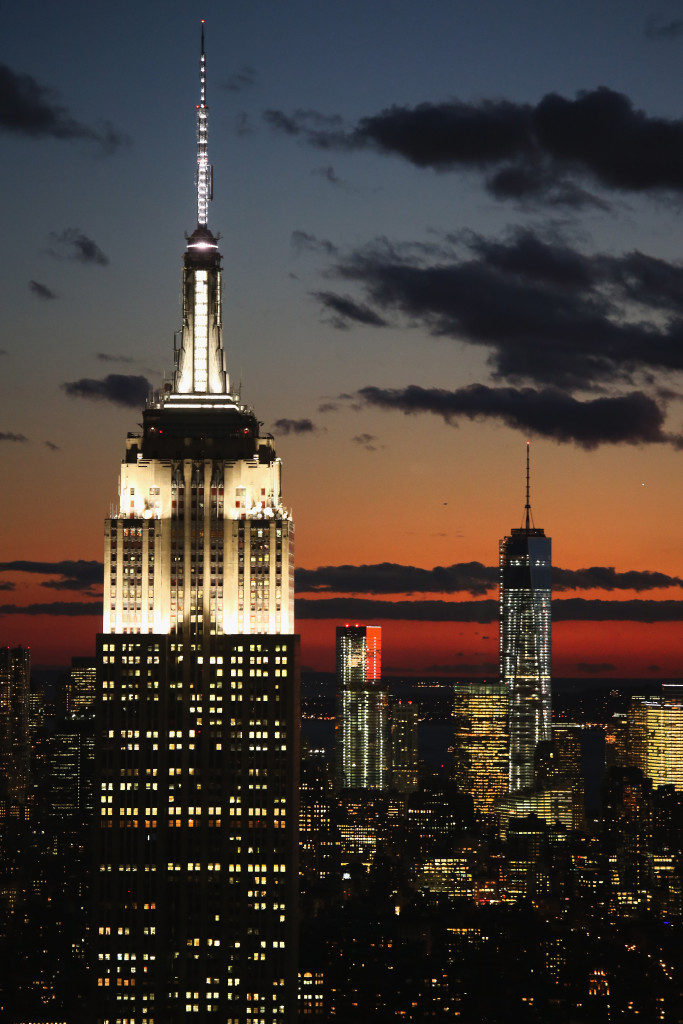 NEW YORK, NY - NOVEMBER 08: The Empire State Building (L) and One World Trade Center (R) tower over Manhattan on November 8, 2013 in New York City. The Council on Tall Buildings and Urban Habitat met in Chicago today to decide whether the One World Trade Center at 1,776 feet, is taller than Chicago's Willis Tower. At issue is the pinnacle of One World Trade and whether it is an antennae or a spire, as antennae are generally not counted in a building's height and spires are. (Photo by John Moore/Getty Images)