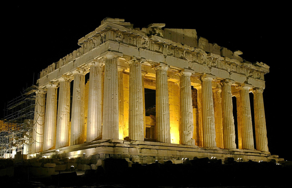 ATHENS - AUGUST 26: The temple of Parthenon is pictured lit up at night atop the ancient Acropolis of Athens on August 26, during the 2004 Olympic Games in Athens, Greece. (Photo by Milos Bicanski/Getty Images)