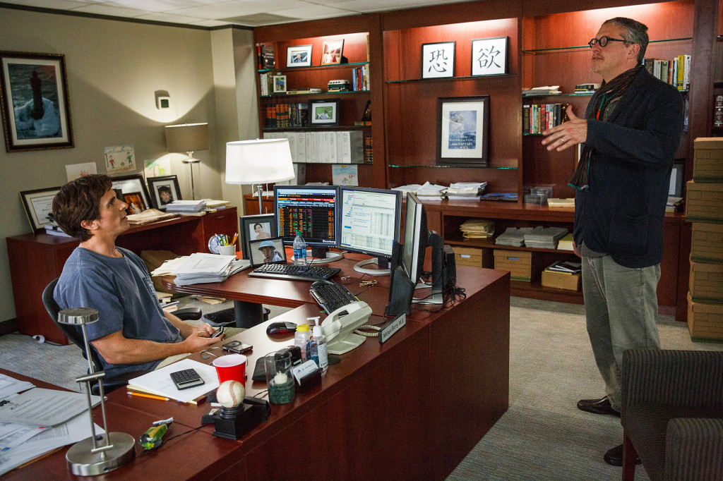 Christian Bale and Director Adam McKay on the set of "The Big Short ." (Photo credit: Jaap Buitendijk)