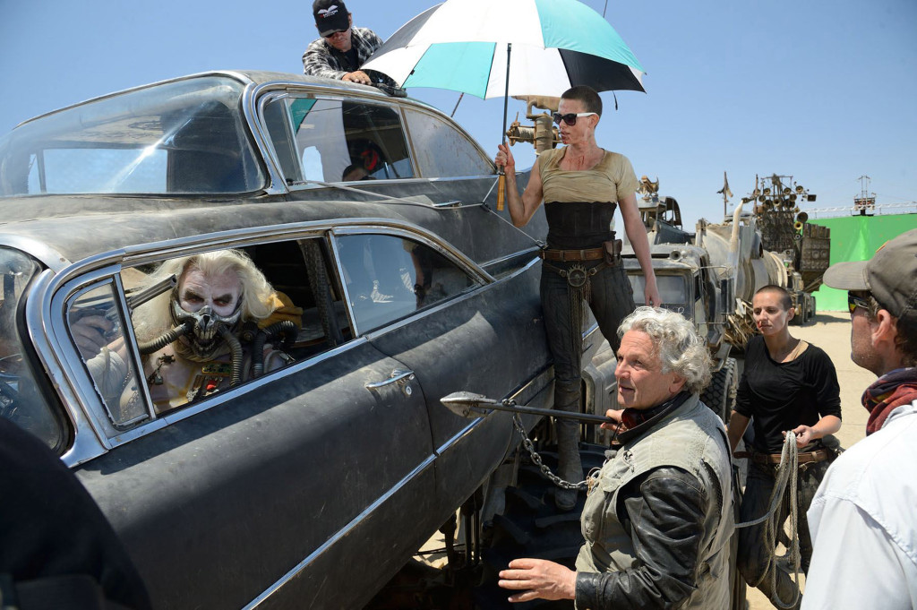 Hugh Keays-Byrne, Charlize Theron and director George Miller on the set of "Mad Max: Fury Road." (Photo Credit: Jasin Boland)