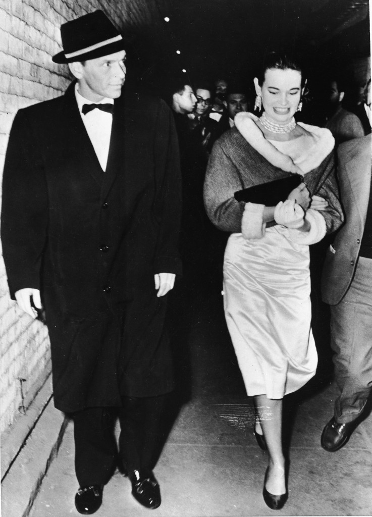 Frank Sinatra walks next to Gloria Vanderbilt in the late 1950s. (Photo by Getty Images)