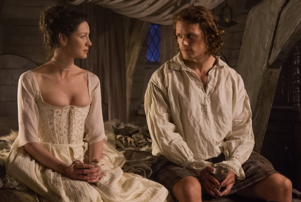 Jamie practicing proper etiquette by looking into Claire's eyes while probably trying to figure out how he's going to rip off that bodice. (Photo Courtesy of Starz)