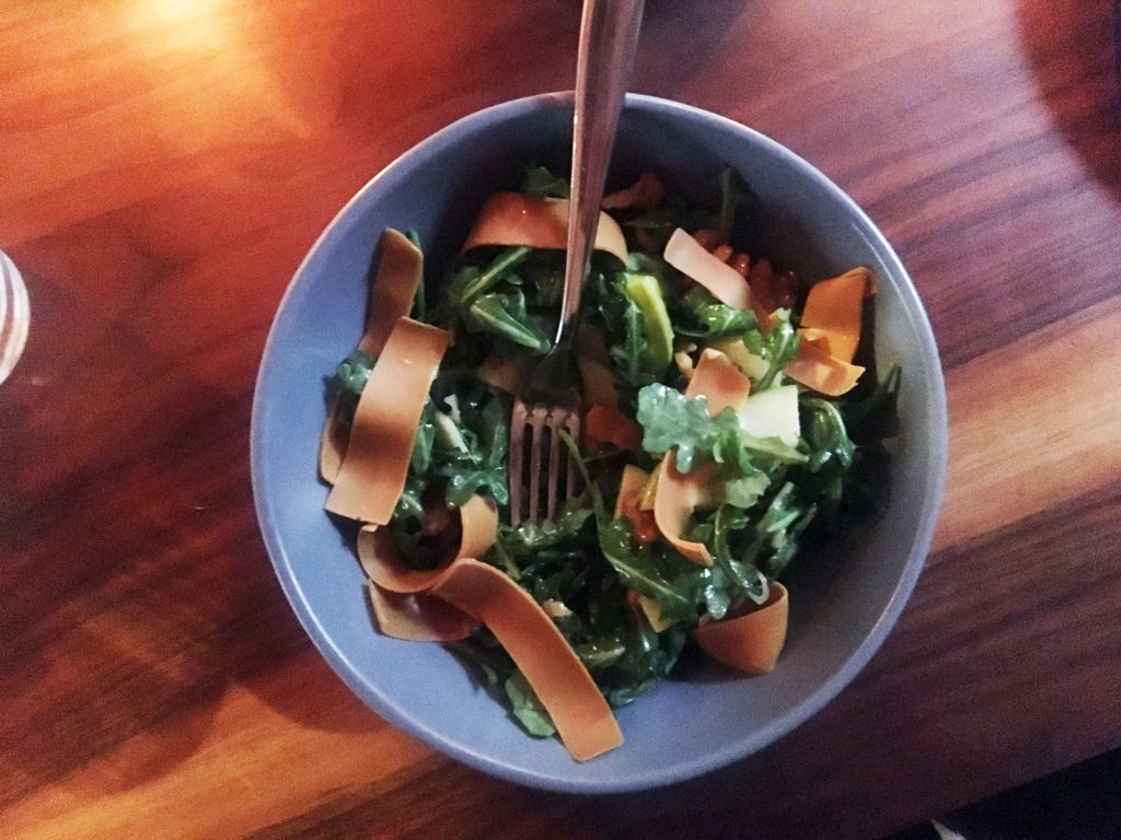 The apple salad served at Wolfdown, complete with strips of gjetost on top.