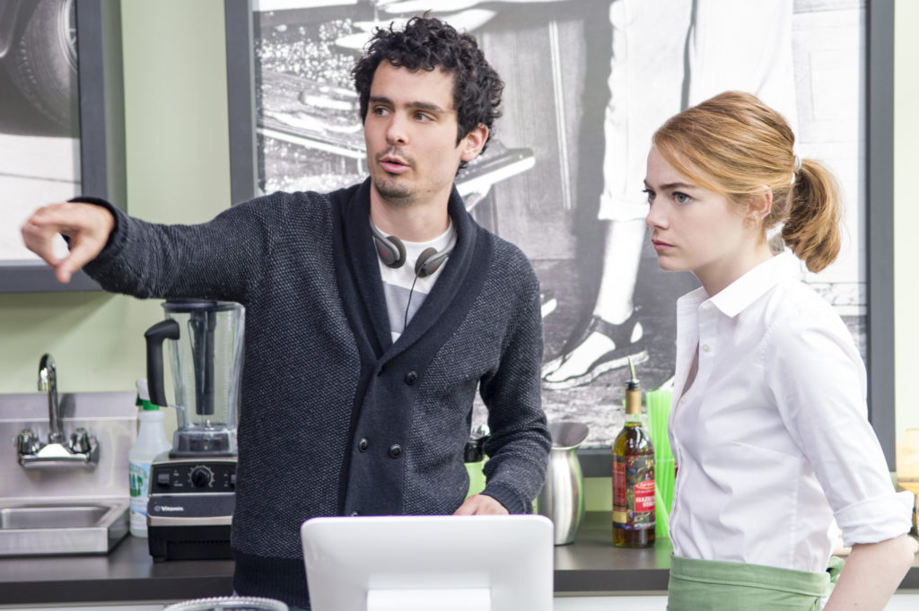 Director Damien Chazelle and Emma Stone on the set of "La La Land."