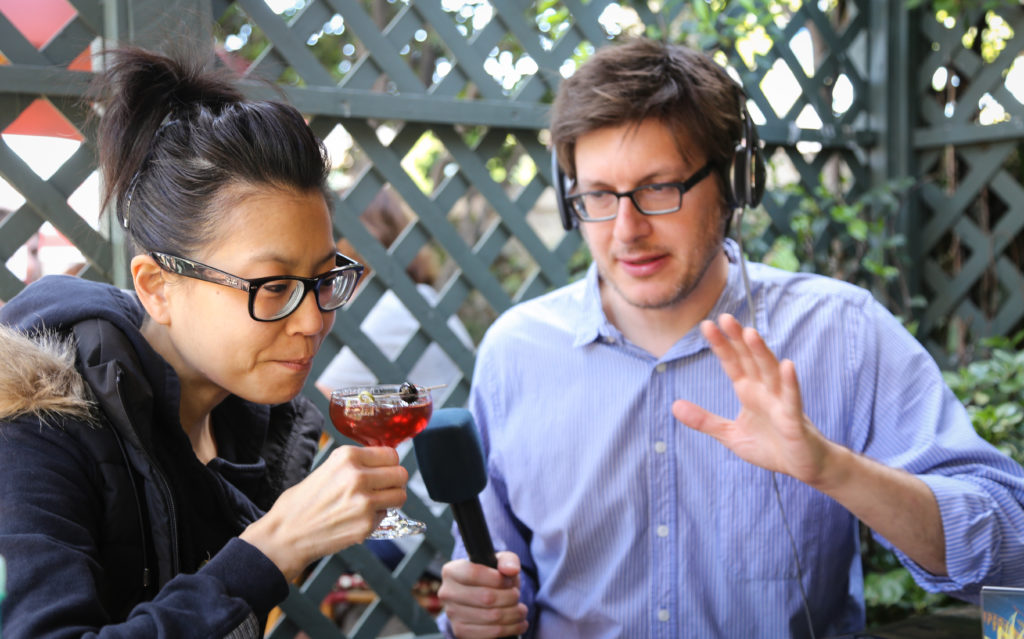 Cari sips on a Manhattan, shaken up at Big Bar in Los Angeles. Rico records the action. (Photo Credit: Eugene Lee)