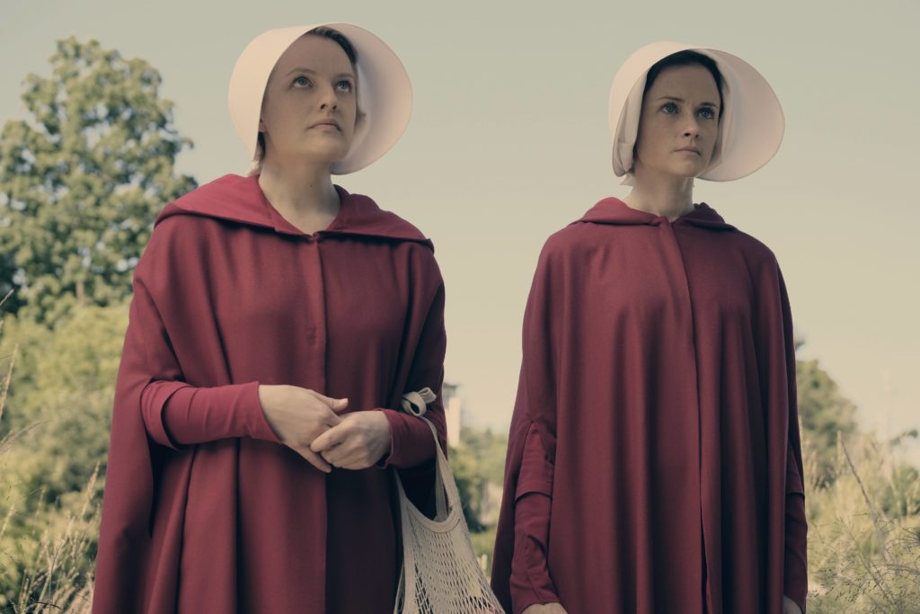 Offred (Elisabeth Moss) and Ofglen (Alexis Bledel), shown. (Photo Credit: George Kraychyk/Hulu)